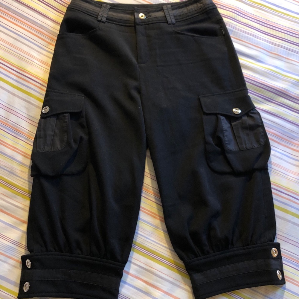 Relaxed Fit Black Cropped Cargo Pants feature a falling just below the knees